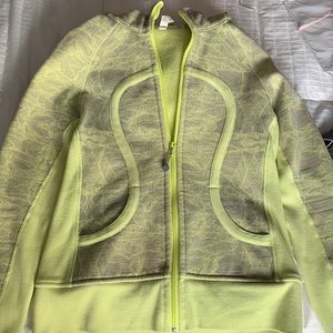 A light green Lululemon Jacket